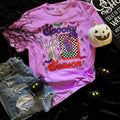 Women’s Spooky Season Switch Soft Graphic Tee by FestiviTees featuring neon violet Halloween-themed design on a comfortable T-shirt.
