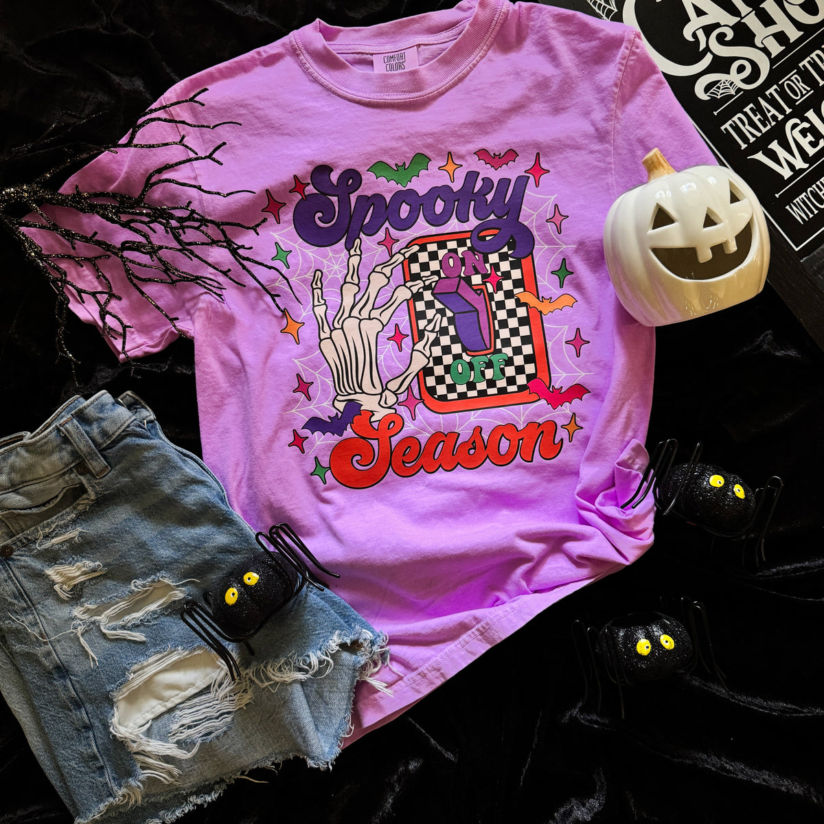 Women’s Spooky Season Switch Soft Graphic Tee by FestiviTees featuring neon violet Halloween-themed design on a comfortable T-shirt.