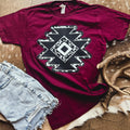 Women’s burgundy cowprint Aztec diamond graphic T-shirt by FestiviTees, featuring bold print and casual fit.