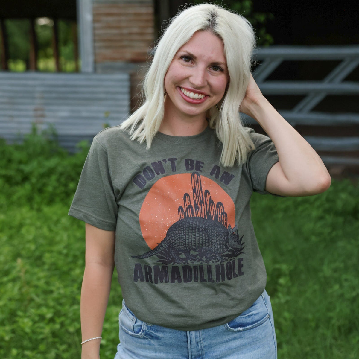 Women’s graphic T-shirt by FestiviTees featuring a humorous “Don’t Be An Armadillhole” design on a casual tee.