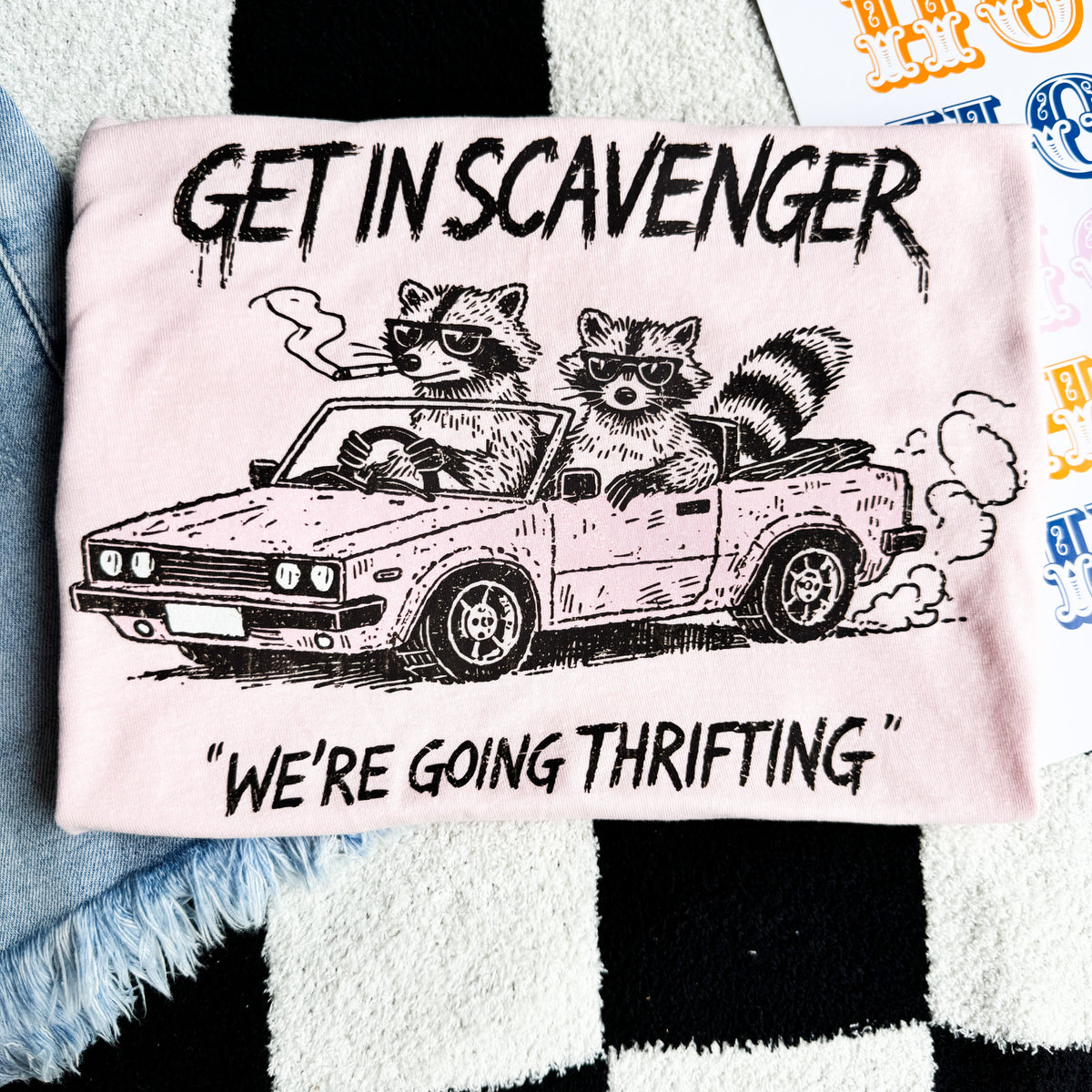 Women's graphic T-shirt by FestiviTees featuring a "Get In Scavenger, We're Going Thrifting" design in casual style.