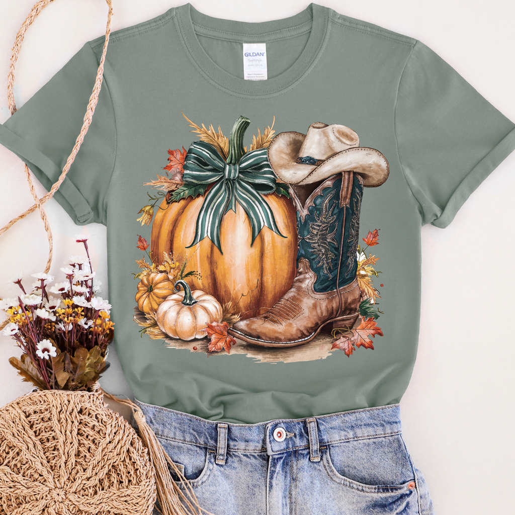Women’s sage green T-shirt with pumpkin and cowboy boot graphic, casual FestiviTees apparel, perfect for fall.