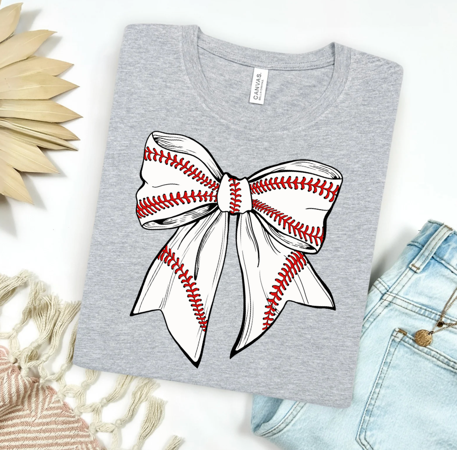 Women’s Baseball Bow Graphic T-Shirt by FestiviTees featuring a playful baseball bow design on a Heather athletic T-shirt.