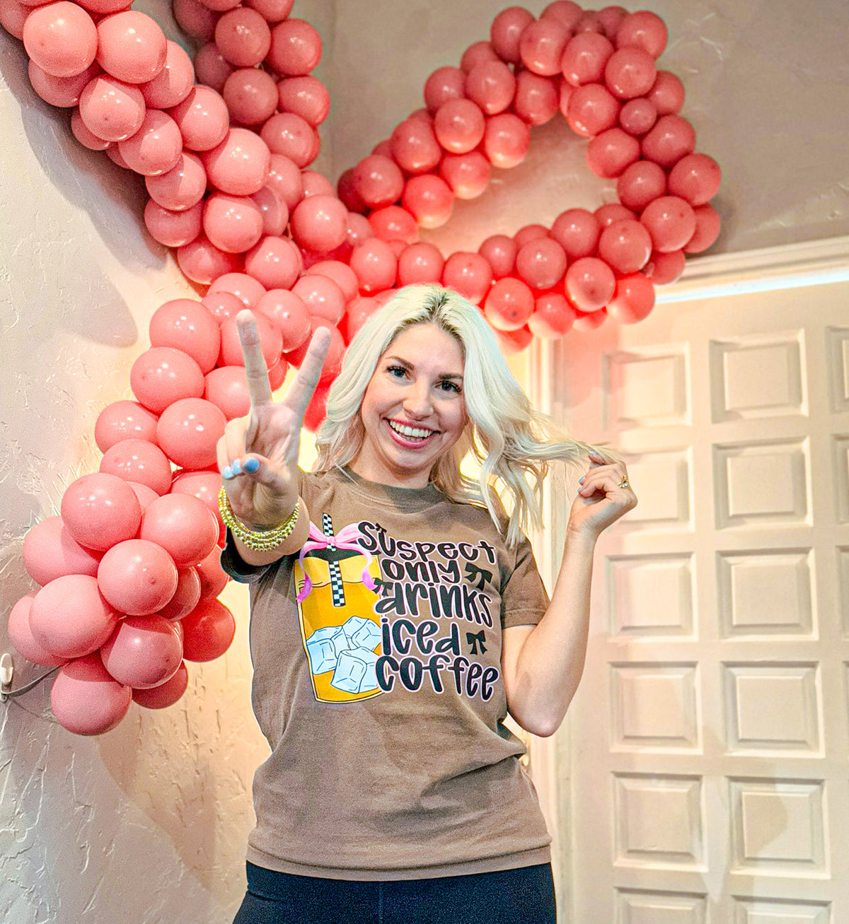 Women’s graphic T-shirt by FestiviTees featuring a Suspect Only Drinks Iced Coffee design in a comfortable, casual style.