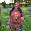 Women’s Retro Cowboy Kid soft graphic T-shirt by FestiviTees, featuring a vintage cowboy kid design on a casual tee.