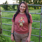 Women’s Retro Cowboy Kid graphic T-shirt by FestiviTees featuring a soft, vintage-style cowboy graphic design.
