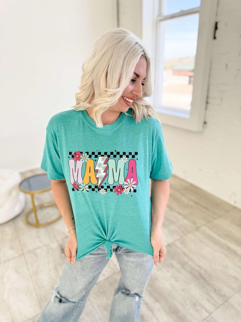 Teal Flower Power Checker Mama graphic T-shirt for women from FestiviTees, featuring bold floral and checkerboard design.