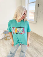 Teal Flower Power Checker Mama graphic T-shirt for women from FestiviTees, featuring bold floral and checkerboard design.