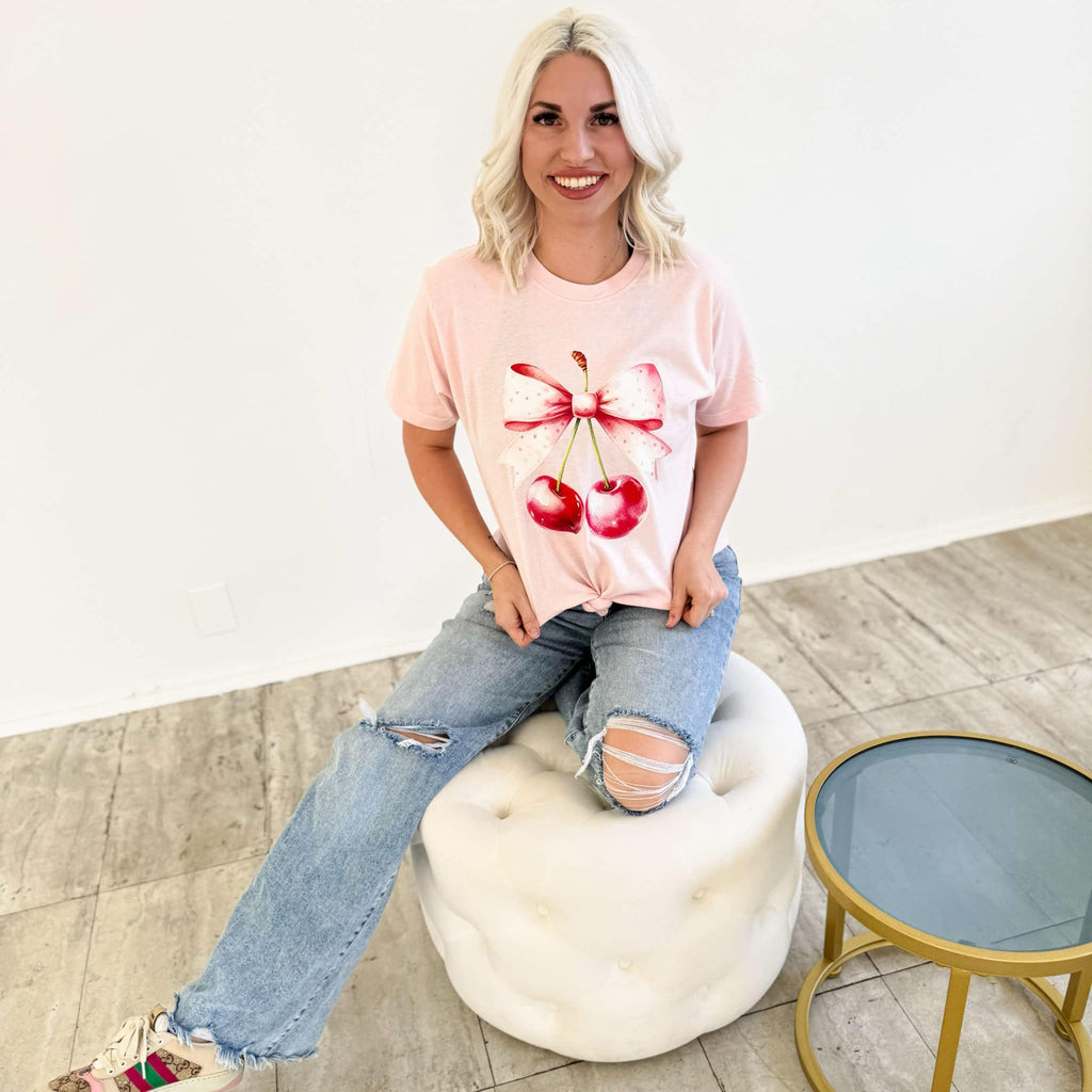 Pink watercolor cherries bow graphic T-shirt for women by FestiviTees, casual cotton shirt with a colorful cherry design.