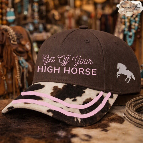 Brown cowboy hat by GRACE+EMMA with cow print and "Get Off Your High Horse" text, featuring a stylish western design.