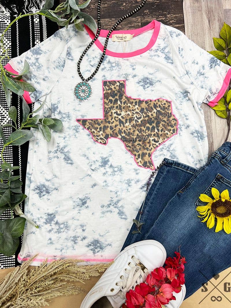 White Ringer Tee by GRACE+EMMA with leopard Texas design on marble pink background, casual and trendy women's t-shirt.