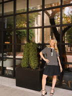 Black striped knit top with attached skirt, women's dress by Grace+Emma, stylish and comfortable for casual wear.