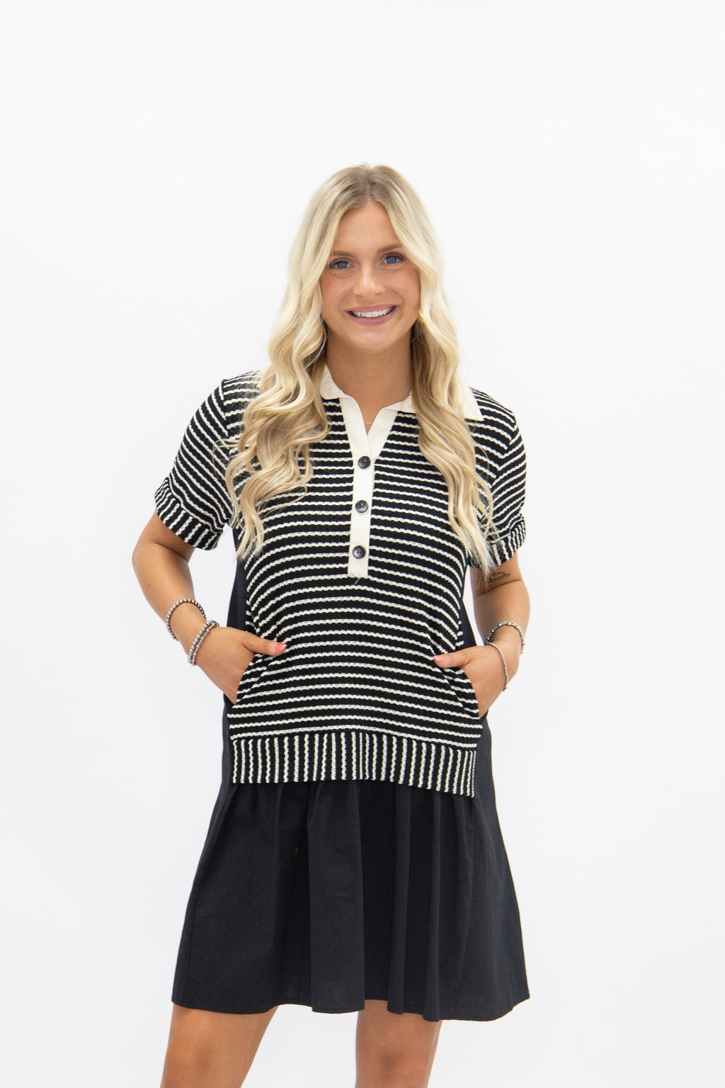 Black striped knit top with attached skirt, women's dress by Grace+Emma, featuring a fitted bodice and stylish design.