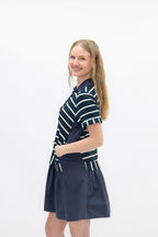 Navy striped knit top with attached skirt, women's dress by Grace+Emma, featuring a fitted bodice and stylish design.