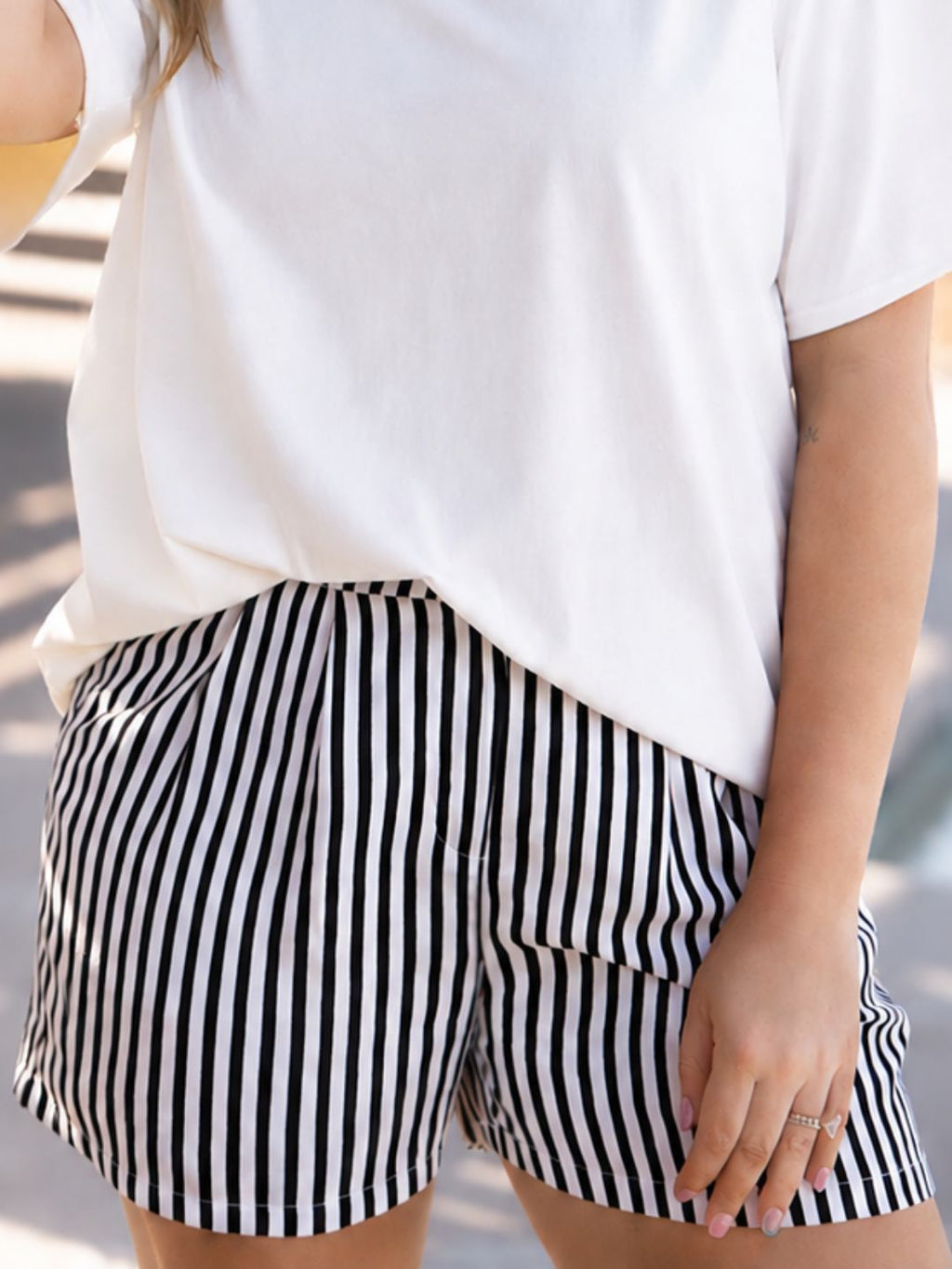 Black striped ladies trouser shorts by Grace+Emma, featuring a stylish, tailored design perfect for casual or semi-formal wear.