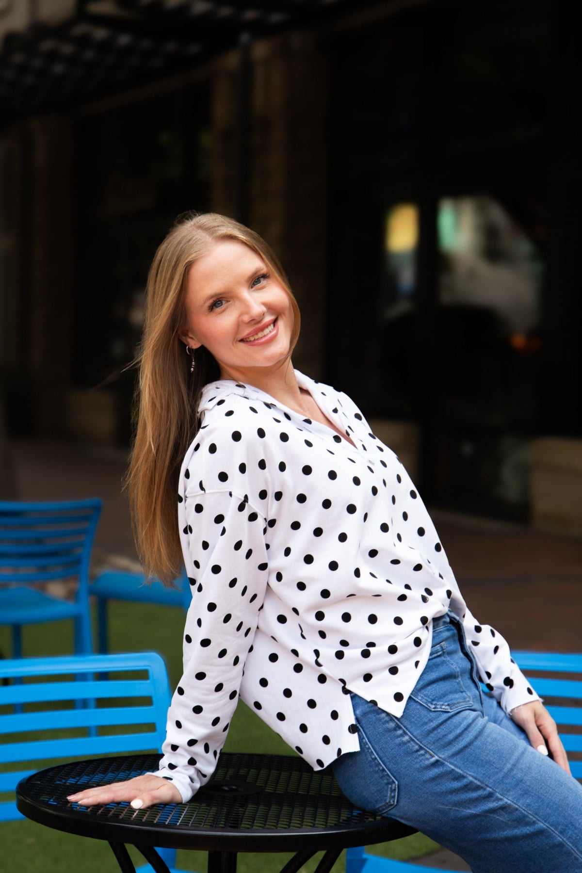 Black polka dot V-neck collared pullover for ladies by Grace+Emma, featuring long sleeves and a relaxed fit.