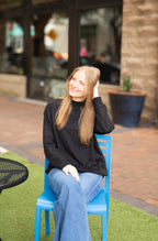 Black Grace+Emma ladies mock neck sweatshirt, casual top with long sleeves and relaxed fit, shown on a white background.