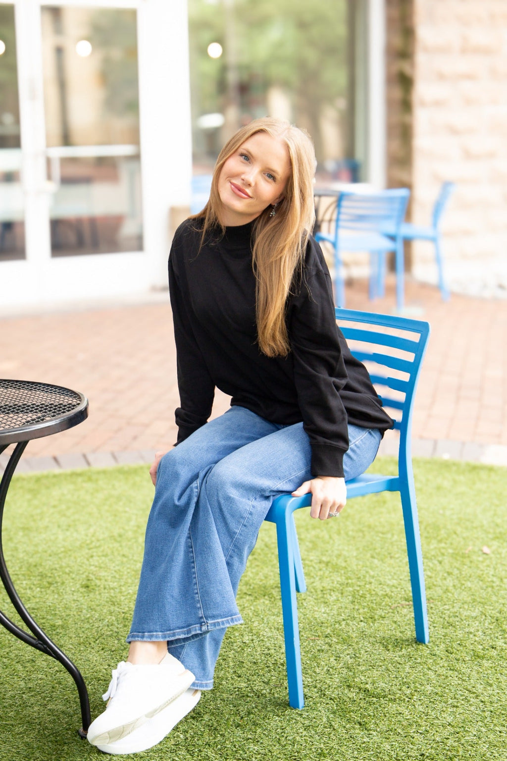 Black Grace+Emma ladies mock neck sweatshirt, cozy long-sleeve top with a fitted silhouette and ribbed cuffs.