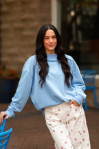 Blue Grace+Emma ladies’ mock neck sweatshirt, casual top with long sleeves and comfortable fit, shown on a model.