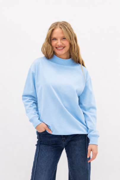 Blue Grace+Emma ladies' mock neck sweatshirt, a cozy and stylish women's top with a fitted design and ribbed cuffs.