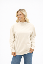 Ivory mock neck sweatshirt for ladies by Grace+Emma, featuring a cozy fit and casual style, shown on a model.