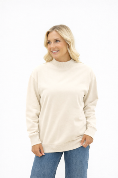 Ivory mock neck sweatshirt for ladies by Grace+Emma, featuring a cozy fit and casual style, shown on a model.