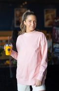Light pink Grace+Emma ladies mock neck sweatshirt, casual top with long sleeves and relaxed fit, suitable for everyday wear.