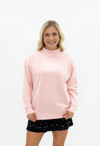 Light pink Grace+Emma ladies' mock neck sweatshirt, casual top with long sleeves and a cozy fit, shown on a model.