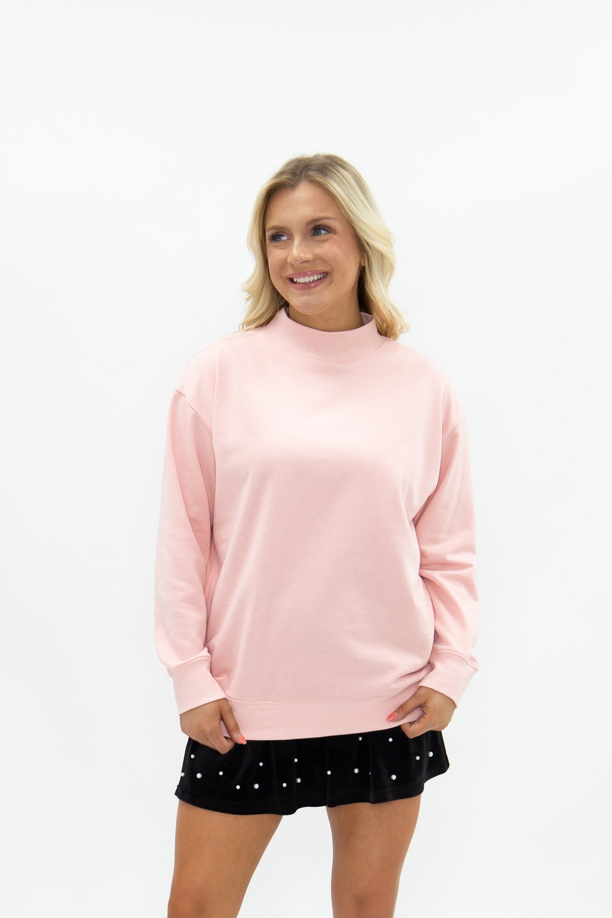 Light pink Grace+Emma ladies' mock neck sweatshirt, casual top with long sleeves and relaxed fit.