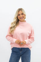 Light pink Grace+Emma ladies' mock neck sweatshirt, casual top with long sleeves and a relaxed fit.