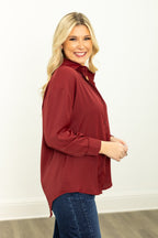 Maroon The Kathryn Button-Up ladies top by Grace+Emma, shown on a model, with long sleeves and a classic collar.