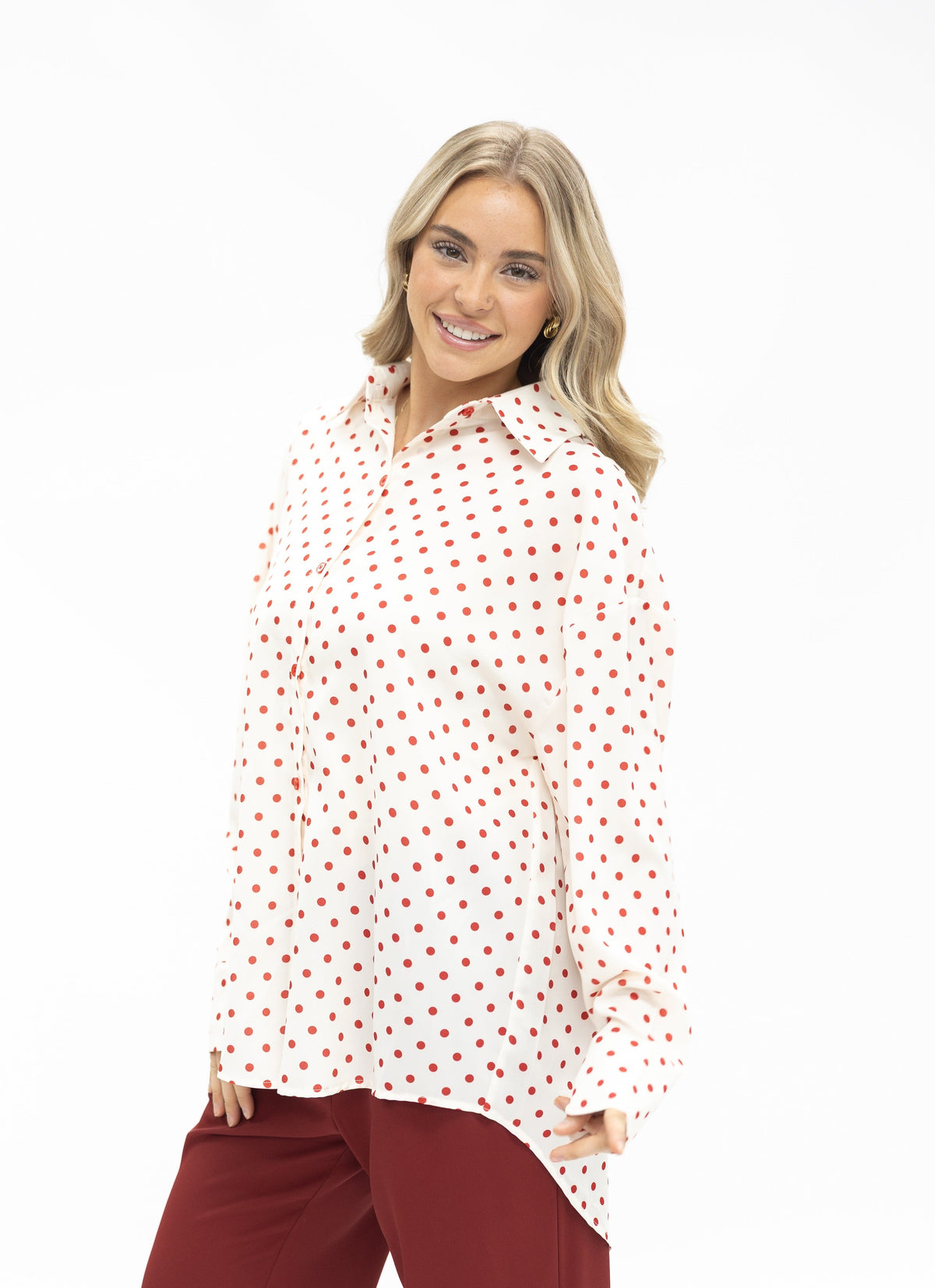 Grace+Emma Kathryn Classic Button-Up women's top in red polka-dot fabric, featuring a button-up design and long sleeves.