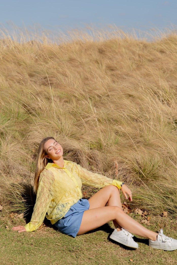 Yellow lace Kathryn Classic button-up top for ladies by Grace+Emma, displayed on a model.