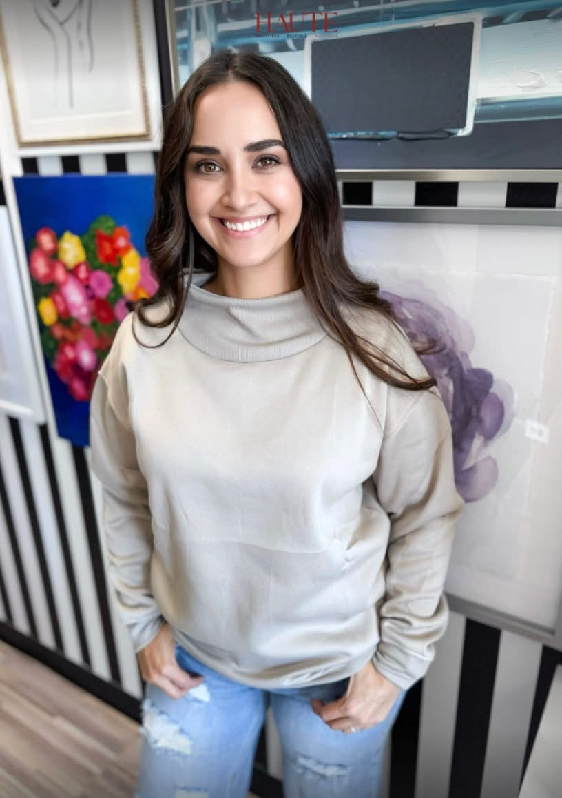 Beige Cloud Nine mock neck sweatshirt by Haute Wholesale, featuring a cozy fit and stylish design for casual wear.
