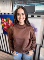 Beige Cloud Nine Mock Neck Sweatshirt by Haute Wholesale, shown on a model, featuring a cozy fit and stylish mock neckline.