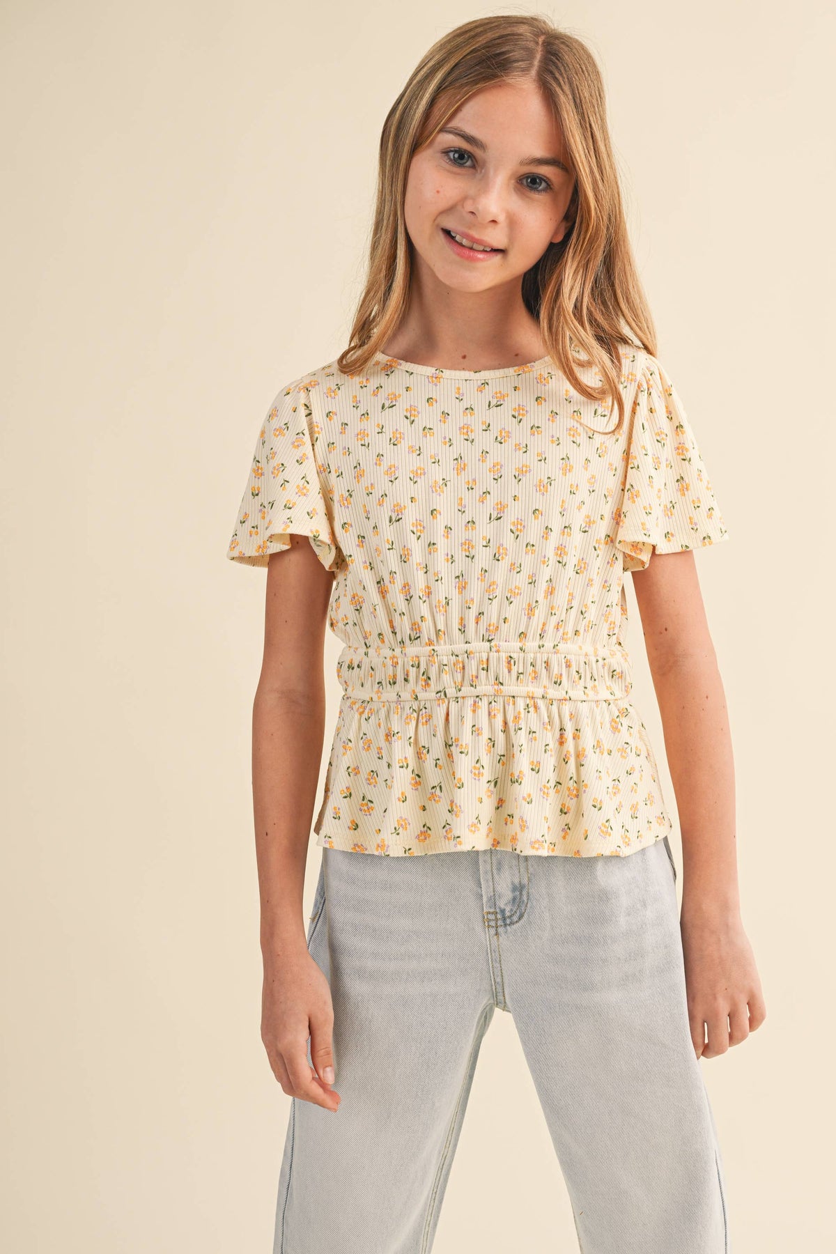 Girls' peplum top by Heart and Arrow with round neck and flutter sleeves, perfect for tween kids' casual wear.