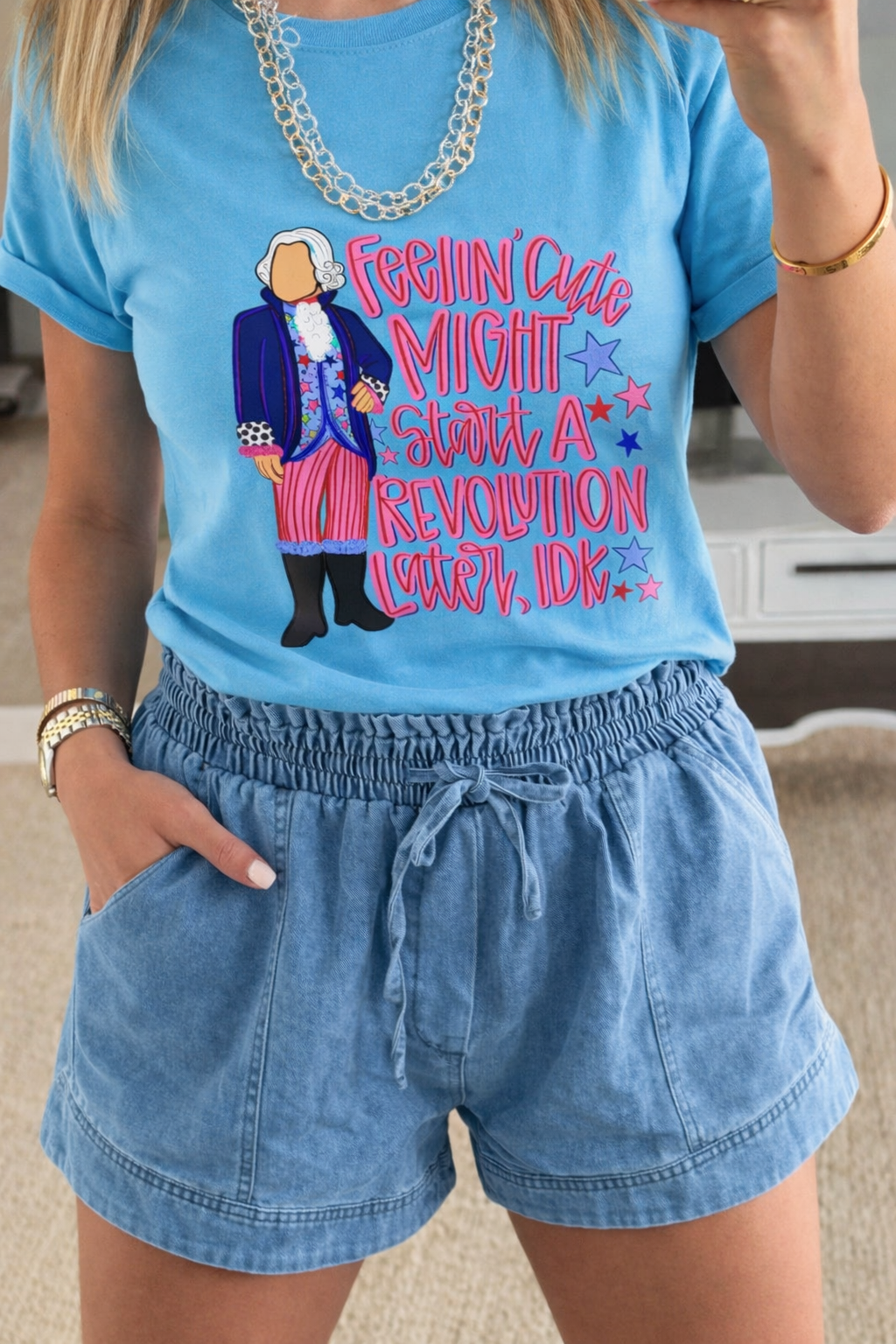 Houston Customs Feelin' Cute Might Start a Revolution Later, Idk graphic on a small white T-shirt.