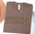 Small leopard print teacher tee from Houston Customs featuring a stylish leopard pattern on a casual t-shirt.