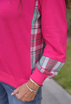 Pink Jess Lea Juniper Plaid Pullover shown on a mannequin, featuring a cozy, stylish knit with a plaid pattern.