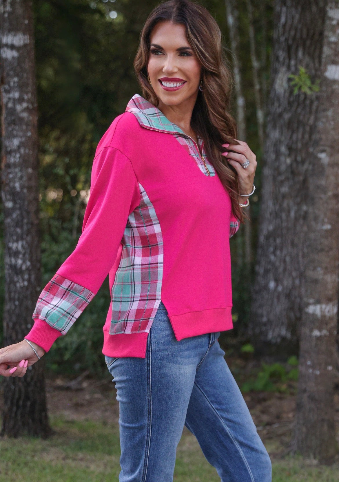 Pink Jess Lea Juniper Plaid Pullover sweater displayed on a hanger with a close-up of the plaid pattern.