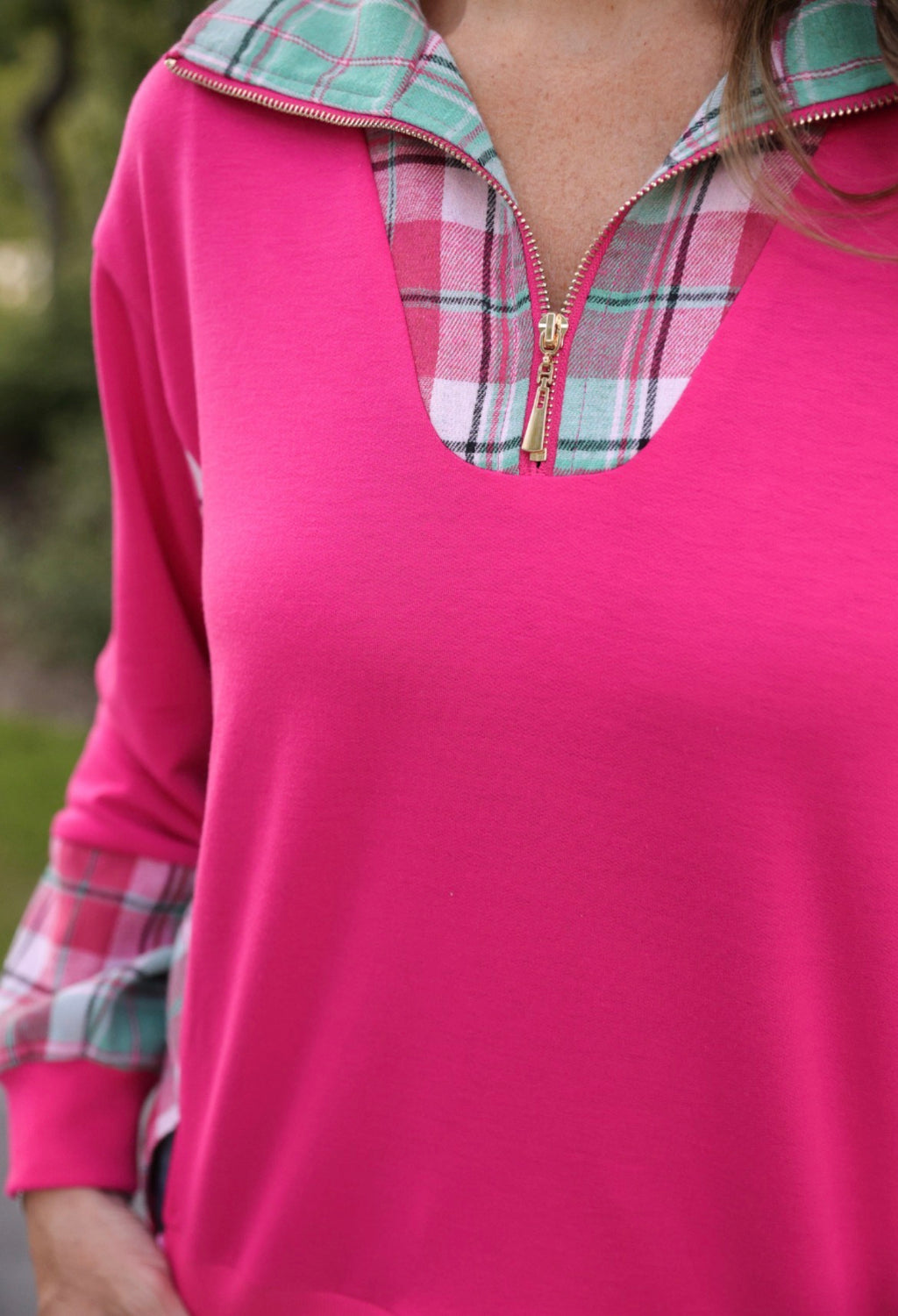 Pink Juniper Plaid Pullover by Jess Lea, featuring a cozy, stylish knit design with a classic plaid pattern and ribbed cuffs.