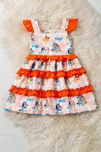 Kids Charm Online dog printed character dress with ruffle trim, featuring colorful dog illustrations and playful ruffle details.