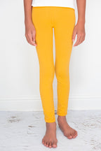 Mila & Rose mustard leggings for babies, soft stretchy fabric, close-up of comfortable baby leggings for ages 6-12 months