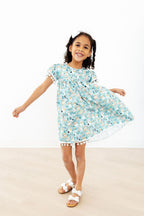 Furry Friends Pom Pom Dress for toddlers by Mila & Rose, pink dress with fluffy pom pom accents, suitable for 12-24 months.