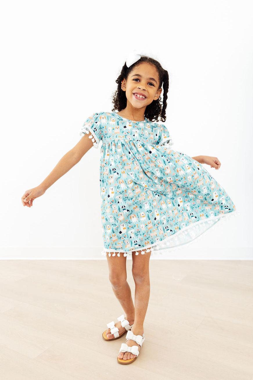 Furry Friends Pom Pom Dress for toddlers by Mila & Rose, pink dress with fluffy pom pom accents, suitable for 12-24 months.