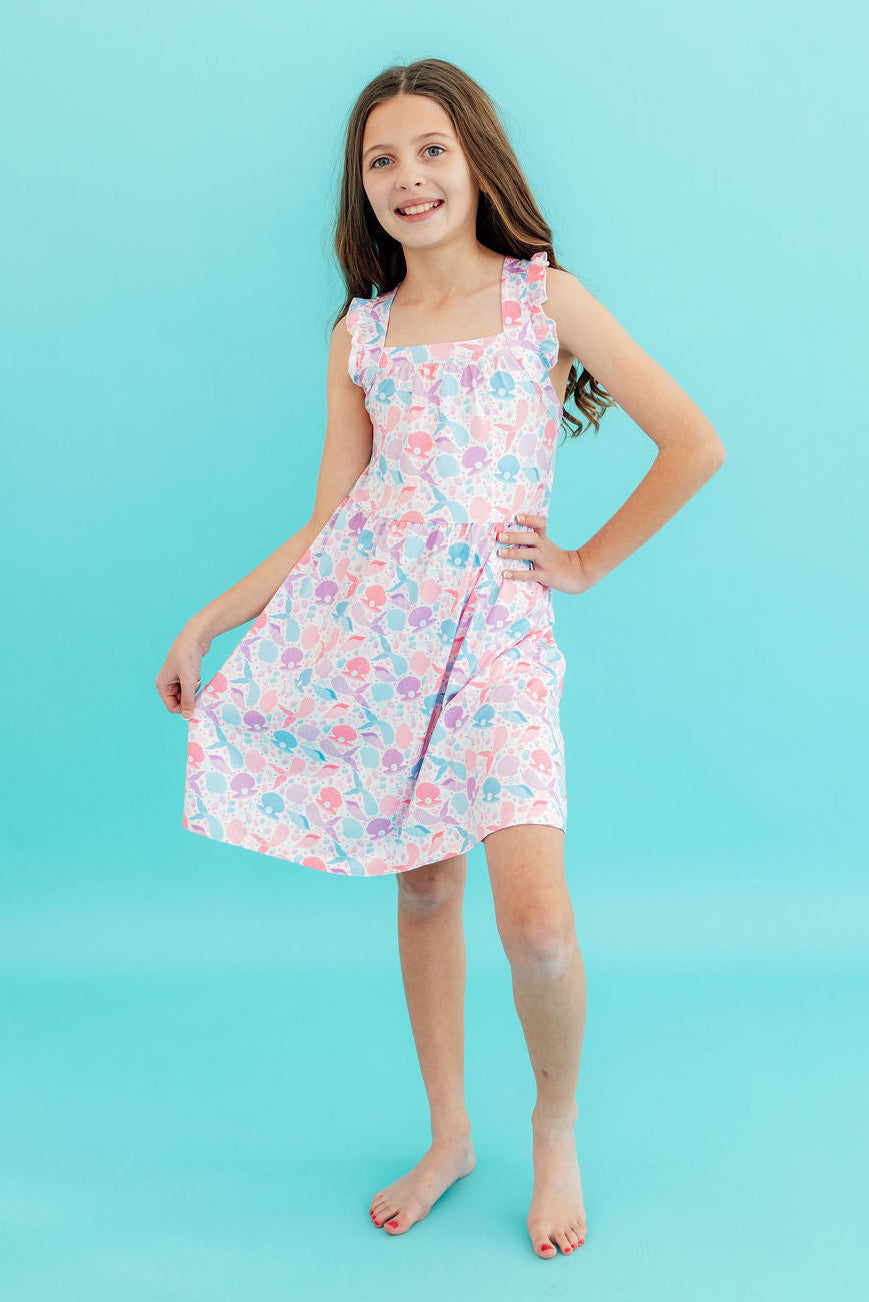 Mila & Rose® Mermaid Tails Ruffle Cross Back Dress for toddler girls, featuring ruffle details and cross-back design.