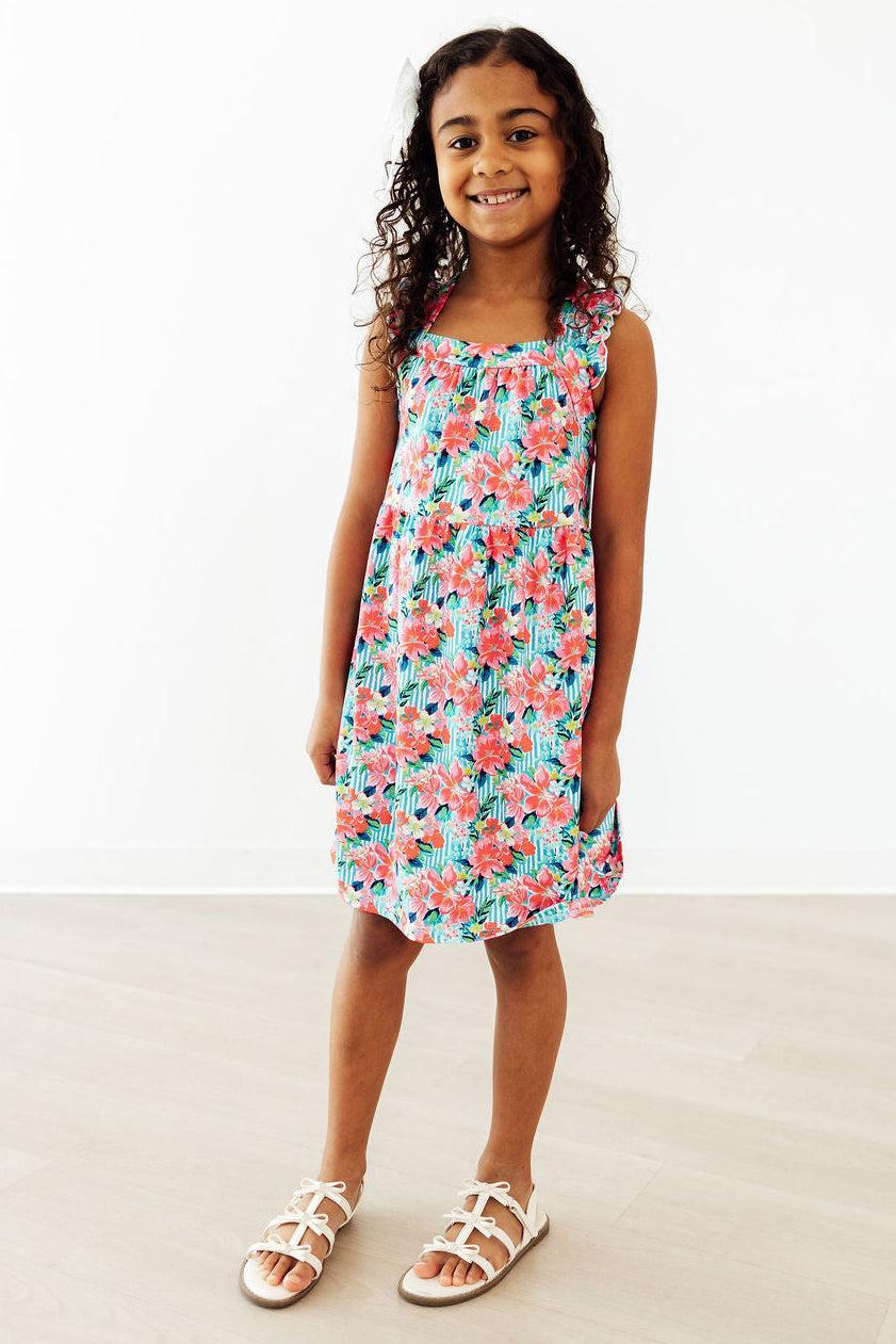 Mila & Rose Petals in Paradise Ruffle Cross Back Dress for toddlers, featuring ruffle details and cross-back design.