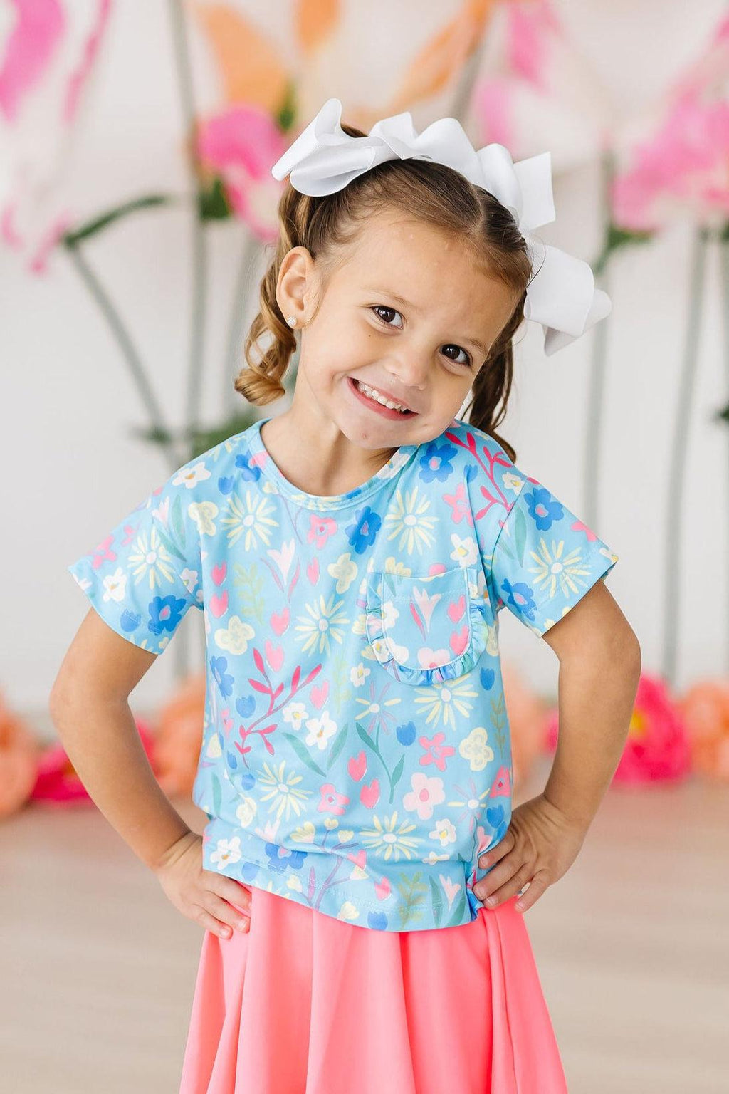 Cute Mila & Rose ruffle pocket tee for toddlers, featuring a springtime splendor design and soft fabric in a playful style.