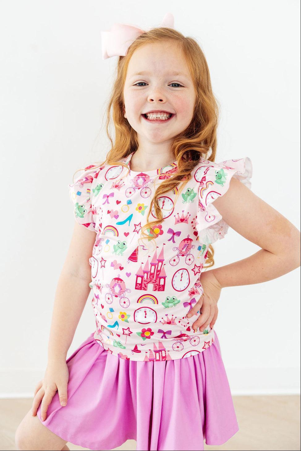 Pink short-sleeve ruffle tee for toddlers from Mila & Rose featuring Princess & the Froggie design, soft fabric and cute ruffle details.