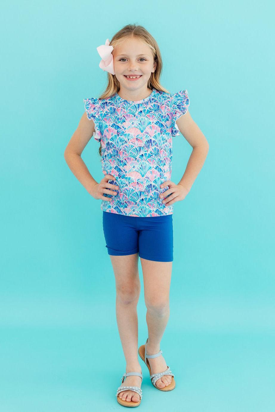 Mila & Rose seaside shells ruffle tee for toddlers, short-sleeve, with a playful shell print and ruffled neckline, suitable for warm weather.